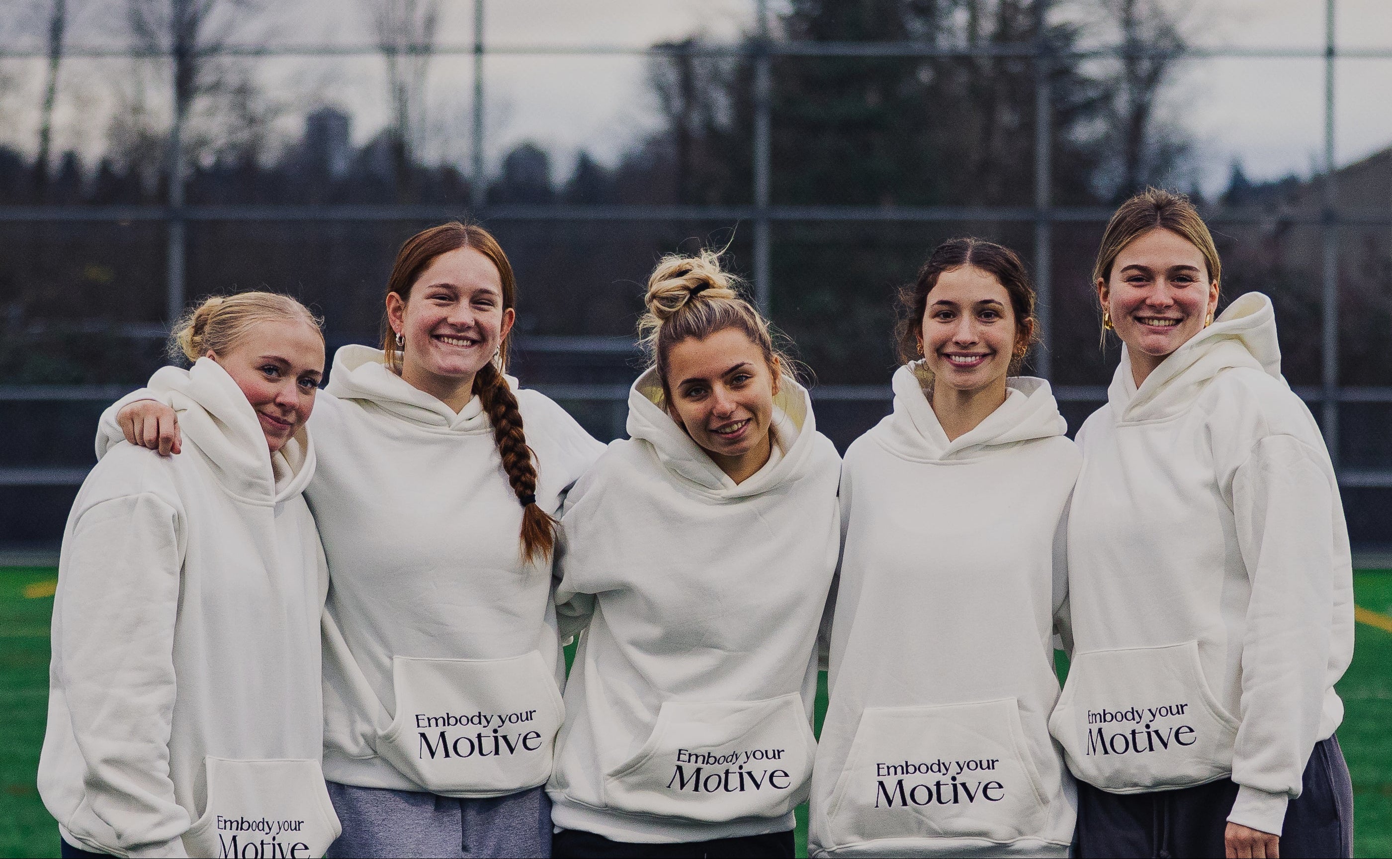 Division 1 Lacrosse players wearing motive athletics hoodies at a camp