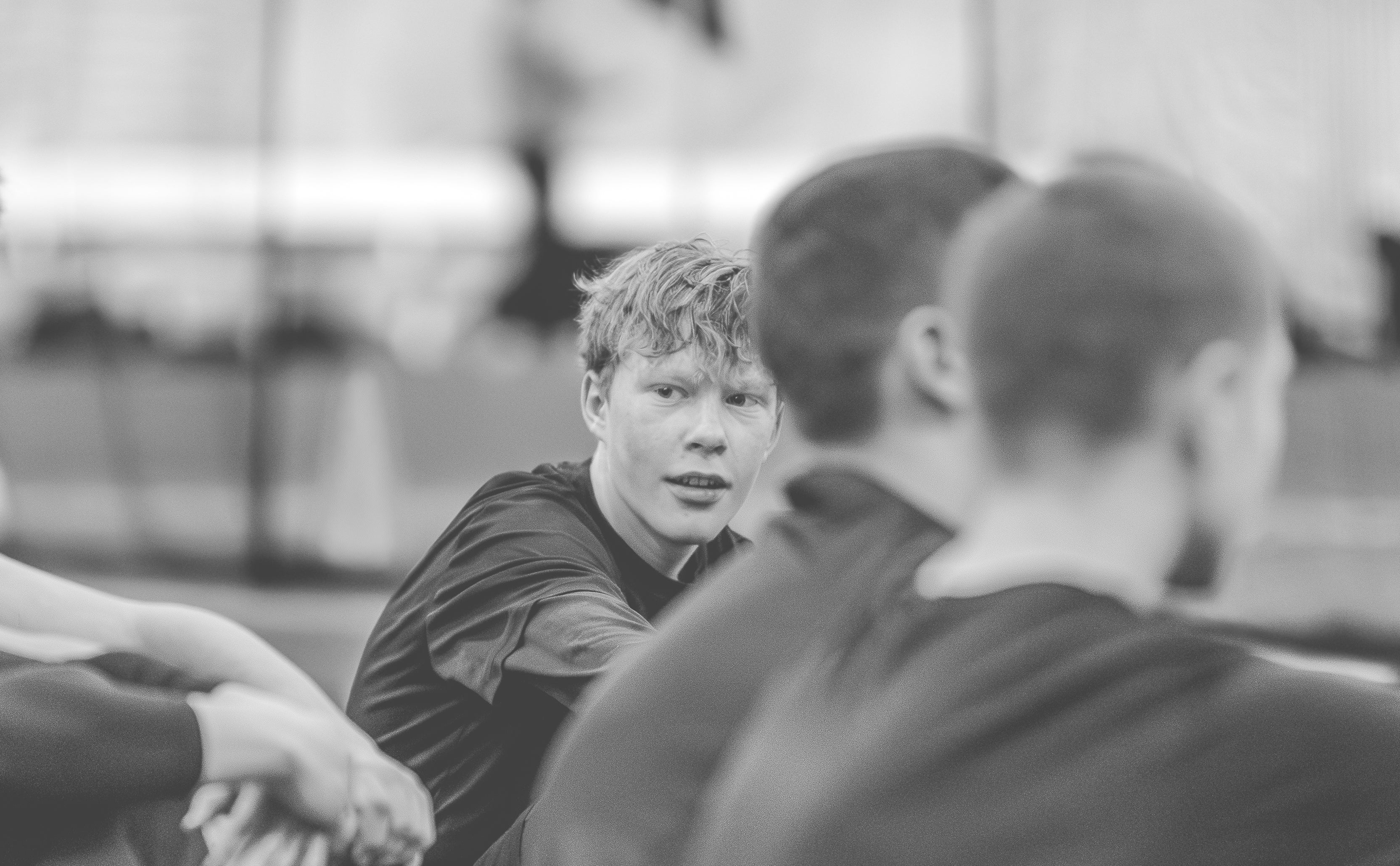 Youth goalkeepers resting during a Motive Athletics goalkeeper camp